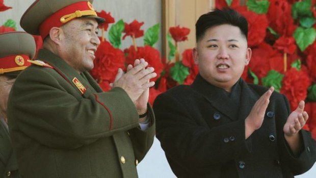 Mentor ... Kim Jong Un, right, exchanges smiles with Ri Yong Ho.