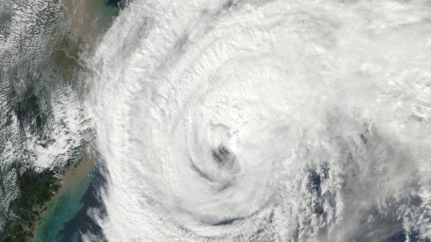 A satellite image from NASA shows Typhoon Vongfong approaching Japan. Attention has now turned to the increasd risk of mudslides due to the huge amount of rainfall the storm has delivered there.