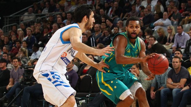 Green and gold return: Patty Mills, who will be a late inclusion for the series against the Tall Blacks, looks to pass during the first match between the Australian Boomers and Greece at Hisense Arena in 2012.
