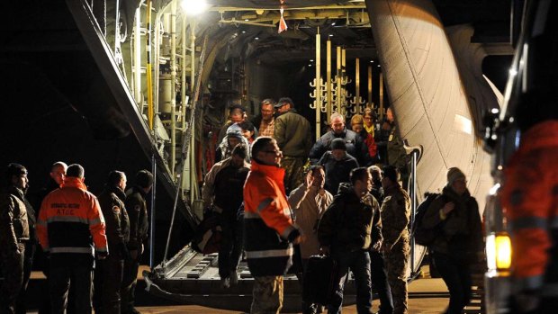 Escape  ... evacuees from Libya disembark in Rome from an Italian military plane.