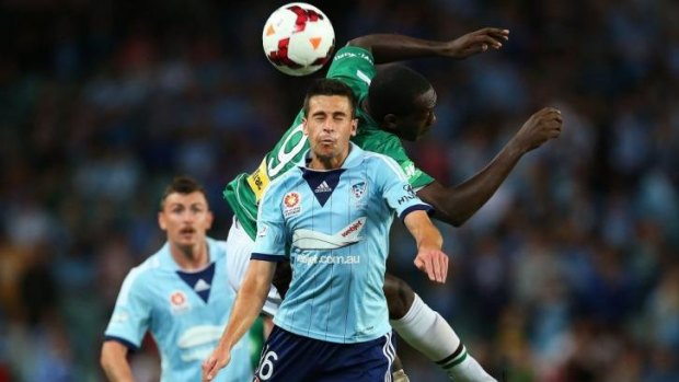 Joel Chianese competes for the ball against Emile Heskey in Sydney's clash with Newcastle last year.