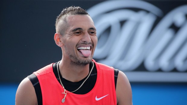 Grin and bear it:  Nick Kyrgios during a first round mixed doubles match.