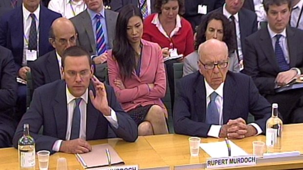 James Murdoch, left, and Rupert Murdoch giving evidence to the Culture, Media and Sport Select Committee in the House of Commons on the News of the World phone-hacking scandal six years ago. The scandal is threating to scupper News Corp's takeover of Sky yet again. 