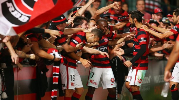 Engagement: Wanderers players interact with their fans.