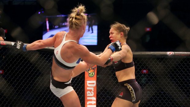 Too good: Holly Holm aims a kick at Ronda Rousey in Melbourne last November.