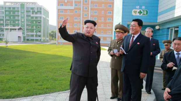 Back, with a limp: North Korean leader Kim Jong-un during an inspection tour of a newly-built housing complex in Pyongyang.