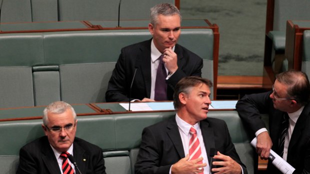 From the crossbenches: Craig Thomson listens to Rob Oakeshott and Anthony Albanese.