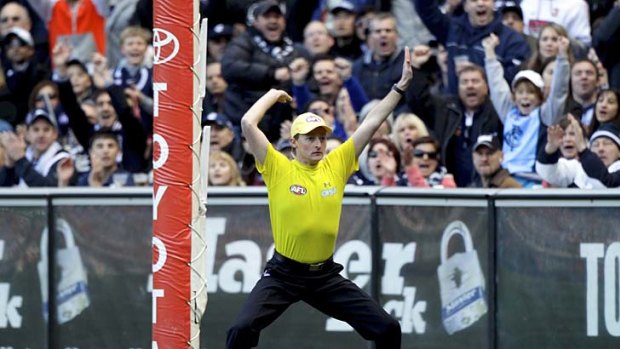 Goal umpire: two of them are needed now, say critics of video review system.