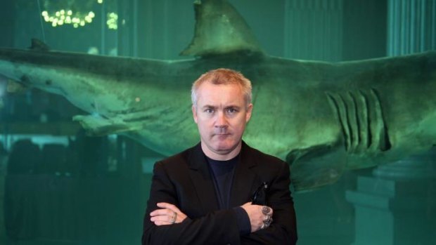 Damien Hirst, who won the Turner Prize in 1995, poses with his 1999 work, <i>The immortal</i>.