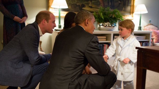 Prince George shakes hands with President Obama at Kensington Palace.