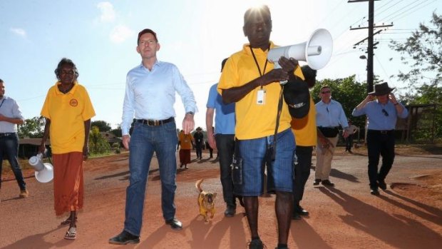 Prime Minister Tony Abbott joins school attendance officers on the walking bus in Yirrkala during his visit to North East Arnhem Land on Wednesday.