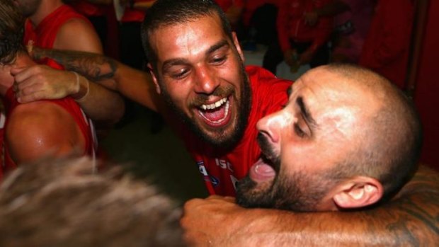 Team bond: Lance Franklin (left) and Rhyce Shaw bang out the club song after a win. 