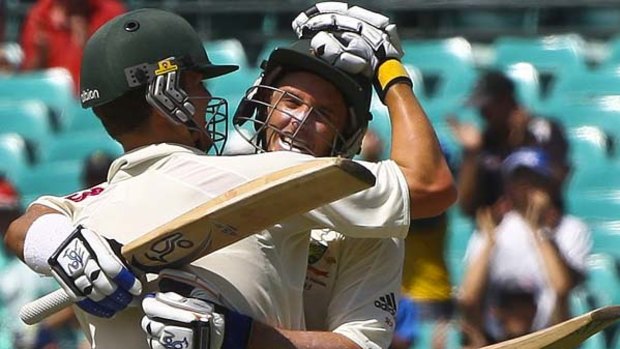 "Tainted" performances ... Mike Hussey gets a hug from Peter Siddle after completing his century at the SCG against Pakistan