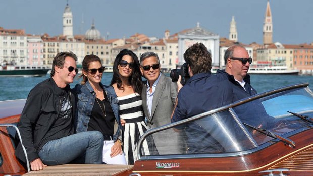 Love boat: George Clooney and Amal Alamuddin arrive in Venice.