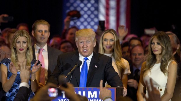 Republican presidential candidate Donald Trump surrounded by his glamorous wife Melania right, daughter Ivanka, left, and son Eric on Tuesday.