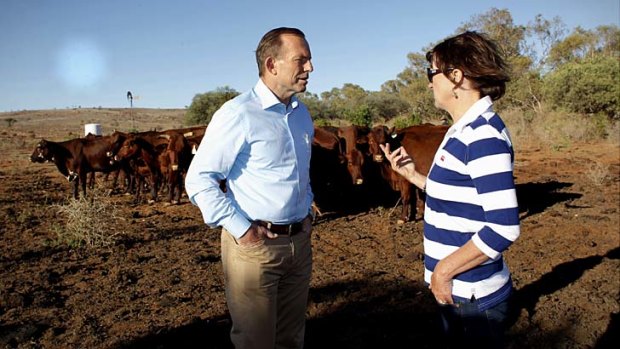 Prime Minister Tony Abbott met grazier Kym Cramp of "Mount Gipps" station near Broken Hill, NSW, as part of a drought tour with Agriculture Minister Barnaby Joyce on Monday.