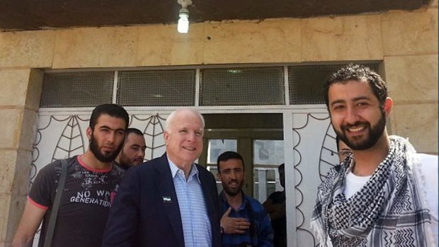 Danger zone: Senator John McCain visits rebels in Syria.  Senator McCain, who slipped into the country for a surprise visit, favours providing arms to rebel forces.