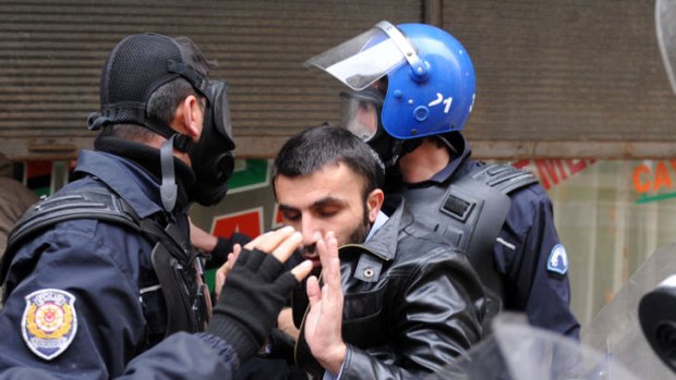 Turkish police arrest a Kurdish man during a demonstration in the main Kurdish city Diyarbakir.