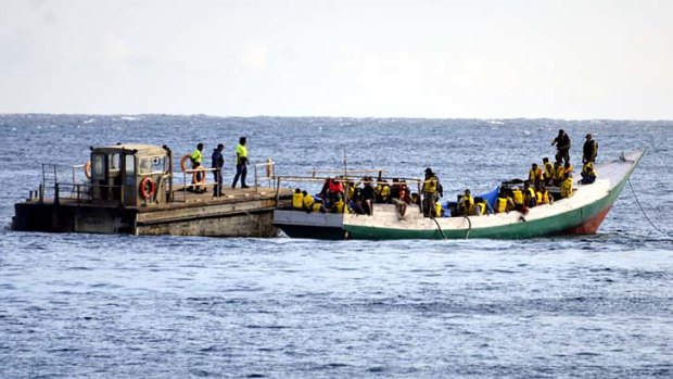 A boatload of asylum seekers arrives at Christmas Island on July 22, 2013 .