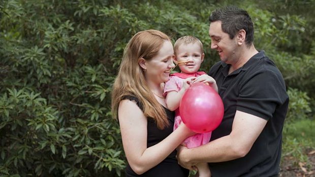 Fighting spirit: Indie Rose with parents Jen Smith and Jai Taurima .