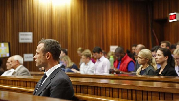 Oscar Pistorius listens to cross questioning in court during his trial at the high court in Pretoria.