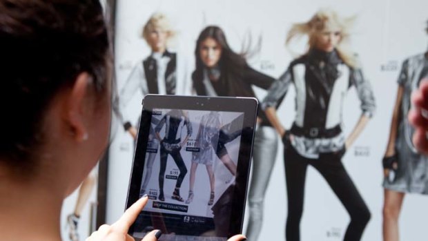 Now you see it ... customers in Sydney shop the Karl range by Karl Lagerfeld using Net-a-Porter's Live app.