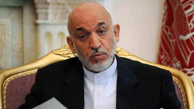 Hamid Karzai ... elected in poll racked by fraud.