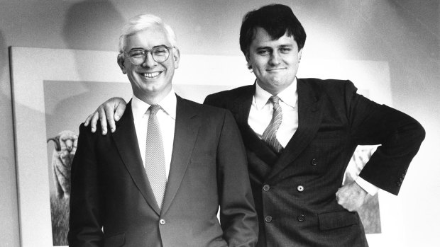 Nick Whitlam (left) and Malcolm Turnbull, who is standing on a phone book, in 1988.