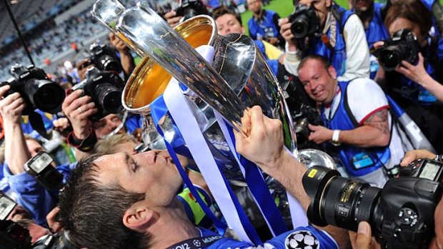 Rapture in Blue: Chelsea captain Frank Lampard gets acquainted with the club's first Champions League winner's trophy.
