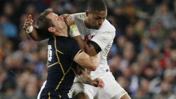 Controversial hit ... Delon Armitage tackles Chris Paterson in Auckland during the World Cup.