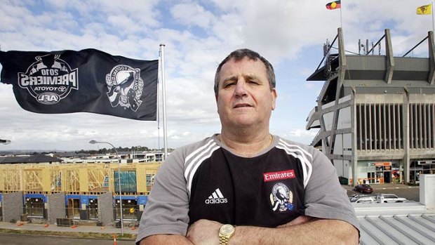 Magpies supporter David Austin's flag is visible from the Hawks' headquarters at the old VFL Park.