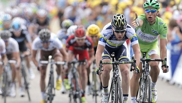 Peter Sagan of Slovakia gesticulates at Matt Goss of Australia as the peloton sprints for the finish line during this year's Tour de France.