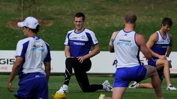 Going forward: Drew Petrie (second left) at North Melbourne's training session at Arden Street last night.