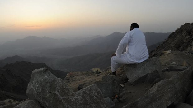 A man waits for Ramadan's new moon.