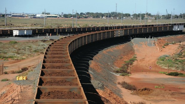 A Fortescue Metals train loaded with iron ore from the company's Cloudbreak operation arrives at their Port Hedland facility for export, in the Pilbara region of Western Australia.