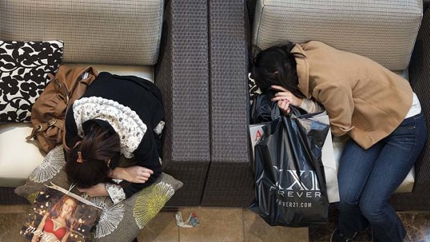 Black Friday shoppers take a rest at Westfield Galleria in Sacramento, California.