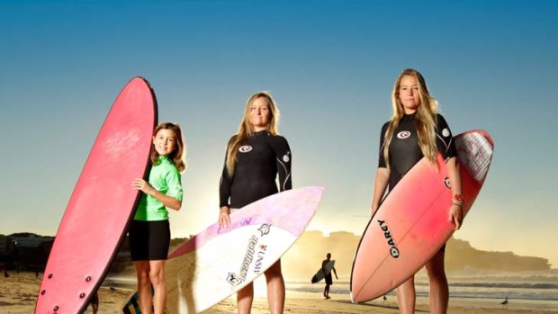 New crew ... Eliza Wachholz, 9, with twins Olivia and Phoebe Miley-Dyer, 19, at Bondi Beach are among the women who make up 30 per cent of Australian surfers.