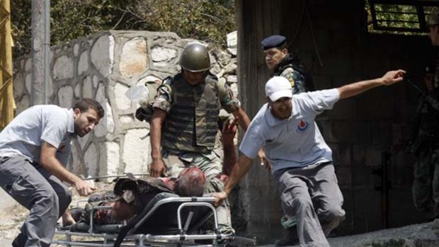 Medics evacuate a Lebanese soldier injured during the skirmish.