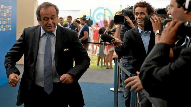 Michel Platini arrives at the World Cup draw in Brazil on Friday.