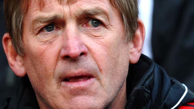 New Liverpool manager Kenny Dalglish feels the pressure against Manchester United at Old Trafford.