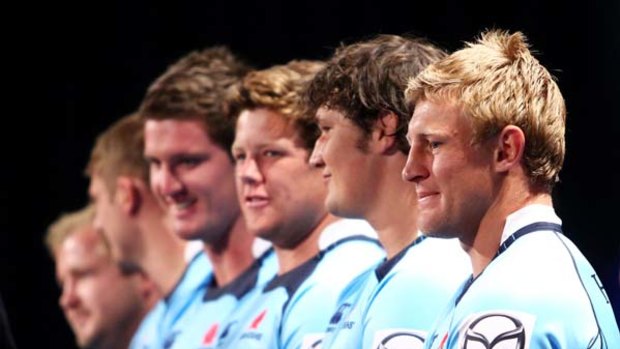 Hoping it's lucky 13 ... Lachie Turner, right, with his teammates at the Waratahs season launch at The Ivy yesterday.