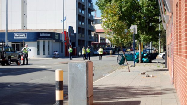 Police inspect the scene of a fatal crash on Bennett Street in East Perth. <i>Photo: David Prestipino</i>