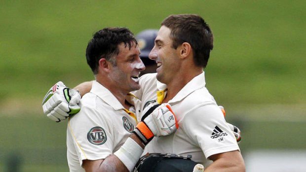 Jubilation ... century makers Shaun Marsh, right, and Michael Hussey hug after Marsh scored a century on debut.