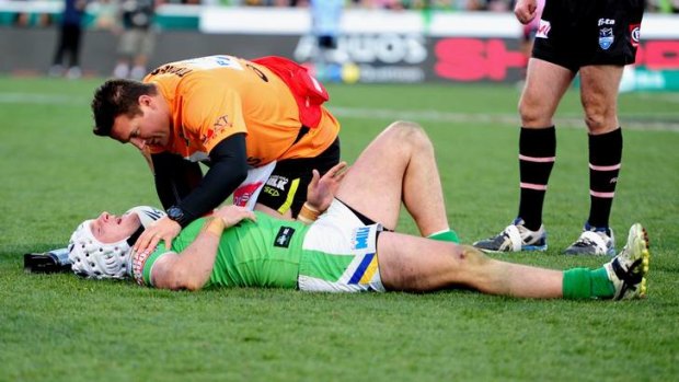 Raiders centre Jarrod Croker is seen to by medical staff after the incident on Sunday.