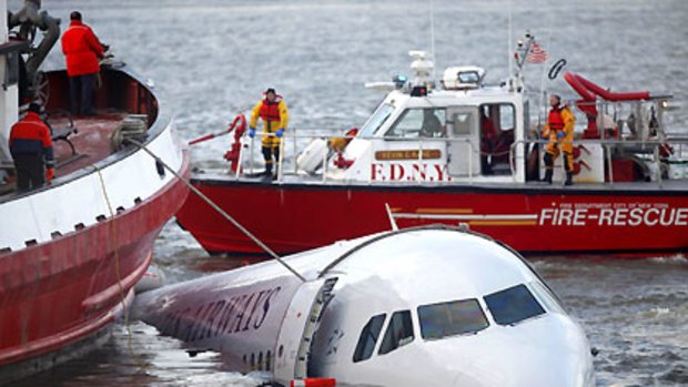 Rescue vessels surround the US Airways plane after it crashed into the Hudson River in New York on January 15. Passengers are now beginning to get their luggage back.