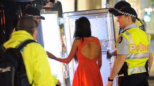 A drunk reveller who has lost her friends - and her shoes - is taken into police custody.