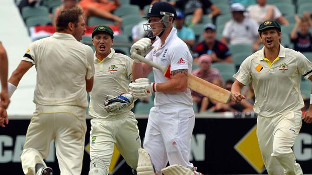Australia's paceman Ryan Harris (left), wicketkeeper Brad Haddin (second right) and Shane Watson (right) celebrate the dismissal of England's batsman Ben Stokes shortly after his contentious clash with Johnson.