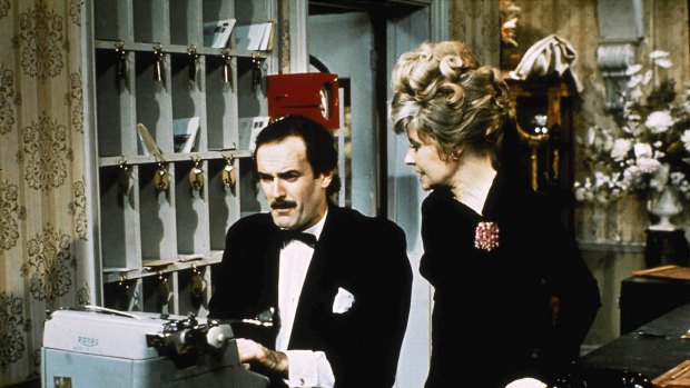 Fawlty reception: Basil and Sybil  at the front desk. 