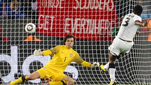 Ghana's striker Asamoah Gyan slots a penalty home against Serbia.