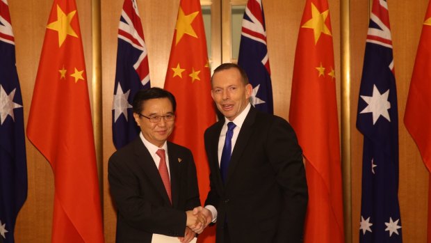 China's Commerce Minister, Gao Hucheng, with Prime Minister Tony Abbott at Parliament House on Wednesday.